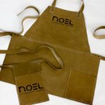 Noel Embossed Leather Apron Colour Tan