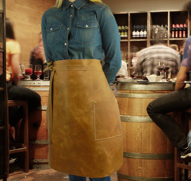 Long leather waist apron in bar worn by model