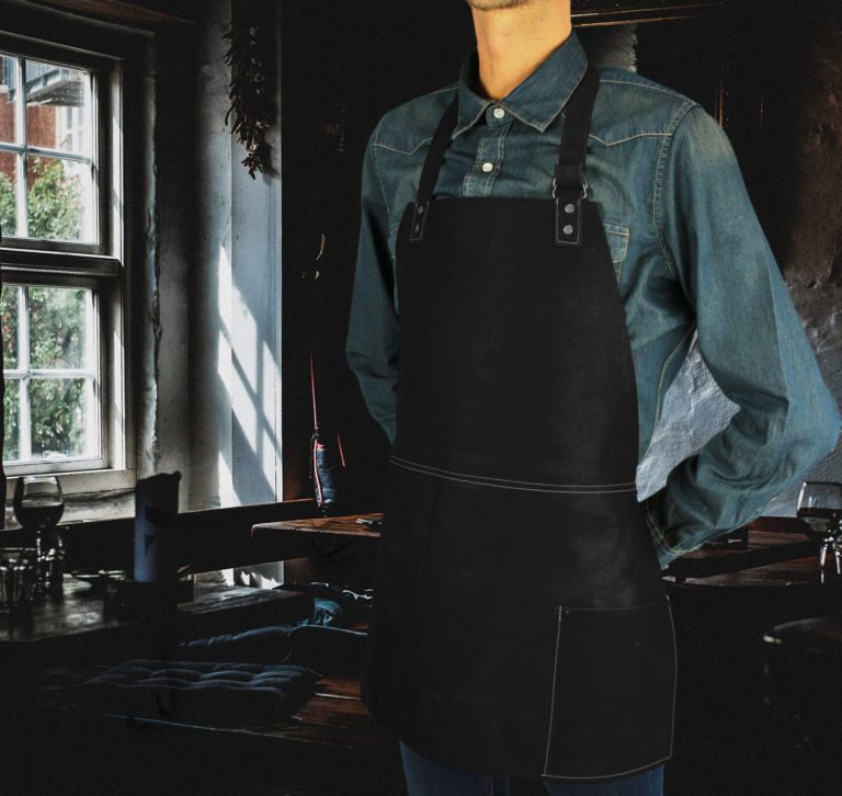 Short leather bib apron worn by model